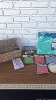 Overall lot: basket, stencil pack, sand packets, dye bag, bead box, masking tape