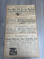 Four The Saratogian newspapers laid out showing full front pages and WWII headlines