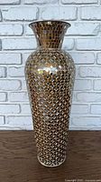 Full view of tall mirrored mosaic glass vase