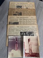 Stacked view of four newspapers with two NASA photos