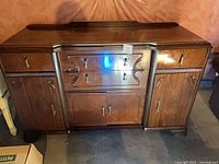 Front view showing entire sideboard with drawers and cabinet doors