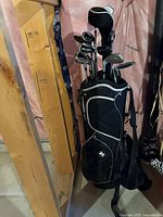 Front view of black RAM cart bag loaded with clubs