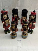 Group shot showing all six nutcracker figures including two on music box bases