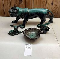 All visible items—lion, deer, rabbit, leaf dish