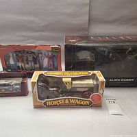 All four boxed collectibles grouped together