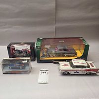 Group shot of all four die-cast models