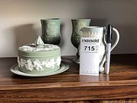 Full lot showing Jasperware candy dish with lid and plate, two Orkney goblets, Jasperware jug