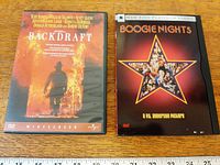 Both DVD cases front view with ruler for scale