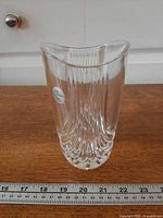 Front view of clear ribbed lead crystal vase with sticker and ruler showing height ~6 in