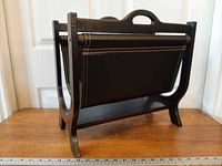 Oblique side view showing wood frame and leather sling