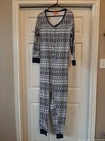 Full front view of adult XL patterned Joe Fresh onesie on hanger