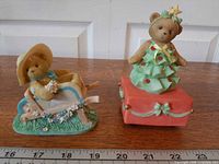 Both Cherished Teddies figurines side by side with ruler for scale