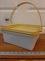 Entire cake taker side view with handle upright