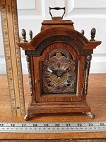 Full view of Warmink mantel clock with rulers indicating size