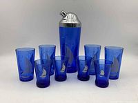 full set showing cocktail shaker, four large tumblers, four small glasses