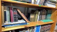 Full bookcase shelf with variety of antique and vintage books