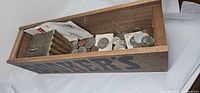 Top view of Booker's box showing coins, coin bank and coin flips