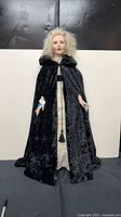 Full view of 3-ft vampire prop doll in black cloak