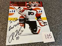 Full view of signed Flyers goalie photo with lot number card