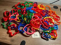pile of multicolor plastic cookie cutters on table