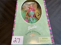 Front of boxed Simply Charming Barbie doll