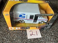 Front view of boxed 1:24 scale Dub City USPS Long Life Vehicle