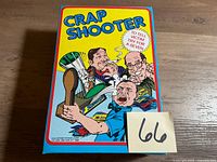 Front of boxed Squirt Crap Shooter showing title and comic artwork