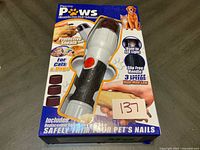 Front of sealed Pretty Paws nail trimmer retail package