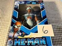 Front view of sealed Stratos figure in original packaging