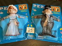 Two packaged PEZ Handy Dandy puppets on card.