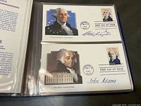George Washington and John Adams First Day Covers in binder sleeve