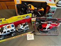 Overview of all three boxed toy vehicle sets