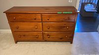 Front view of full dresser showing six drawers and overall appearance