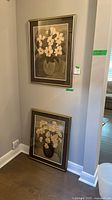 Framed artwork hanging on wall, shows overall composition and frame