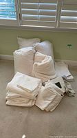 Full group of pillows, linens and sealed sheet set