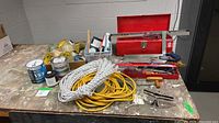 Overall lot showing toolboxes, cord, rope, hand tools and consumables