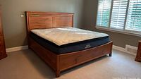 Full view of assembled bed frame with mattress