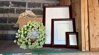 All three wood frames and wreath grouped together for size comparison