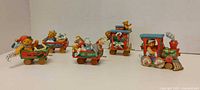 All four Cherished Teddies Christmas train pieces lined up
