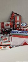 Group shot of all Canadian-themed items including boxer shorts, playing cards, flag, tape, lanyard, keychain