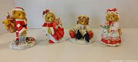 Group shot of all four Cherished Teddies Christmas bear figurines