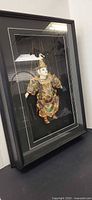 Full view of framed shadowbox with marionette