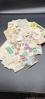 Overview of entire pile of mixed loose stamps