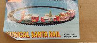 Box art showing Musical Santa Rail, model number, age recommendation