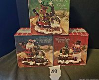 Stacked view of three original boxes showing product images and bilingual text