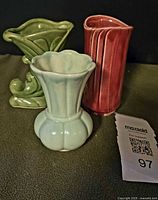 Three vases grouped together showing colors, shapes and relative sizes