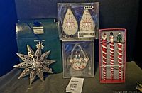 Group shot of all eight boxed ornaments