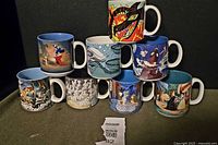 Group view of eight Disney coffee mugs