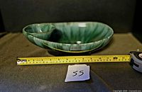 Side profile showing depth and tape measure indicating dimensions