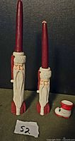 front view of two Santa candle holders and boot toothpick holder